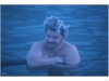 Steam is condensating in your hair while in the pool. It's so cool it becomes ice.